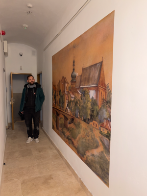 wielkoformatowy druk UV na ścianie przedstawiający zabudowę